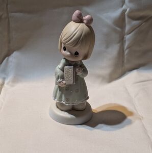 Precious Moments Figurine with Green Dress and Pink Bow